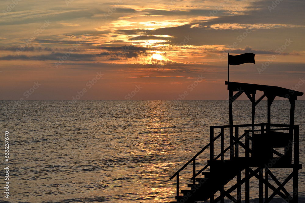 Lifeguard post on the coast at the sunrise Lifeguard post on the coast at the sunrise