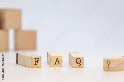 FAQ Text in wooden cubes on white background