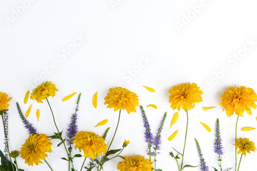 Beautiful blooming  yellow september flowers Rudbeckia, golden ball. Composition, frame folded from yellow flowers. Flowers pattern top view, flat lay, copy space for text. 