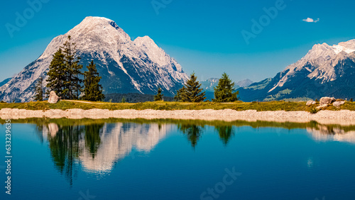 Alpine summer view with reflections at Lake Kaltwassersee, Mount Seefelder Joch, Rosshuette,  Seefeld, Tyrol, Austria photo
