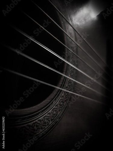 Photography close up classical guitar on black and white (vertical image)