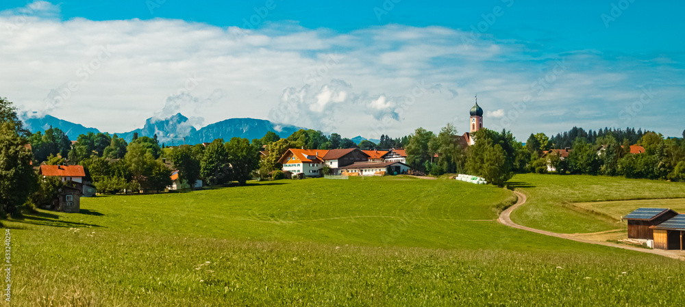 Alpine summer view with a church near Seeg, Ostallgaeu, Bavaria, Germany Alpine summer view with a church near Seeg, Ostallgaeu, Bavaria, Germany