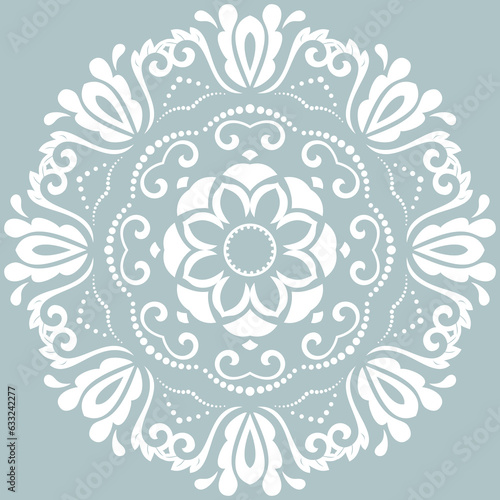Oriental pattern with arabesques and floral elements. Light blue and white traditional classic ornament. Vintage pattern with arabesques