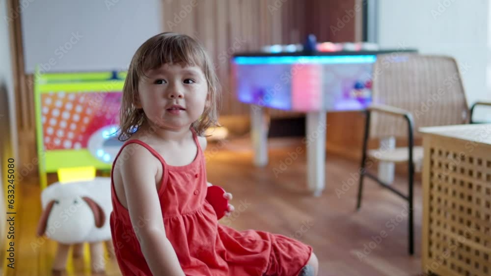 Shy Timid Adorable 3 Year Old Toddler Girl in Arcade Machine Playroom - slow motion Shy Timid Adorable 3 Year Old Toddler Girl in Arcade Machine Playroom - slow motion