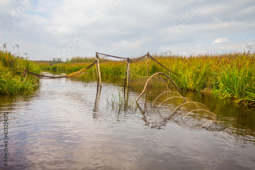 Old trap net (bent willow branches used); fyke hoop net on fishway of Ilmen lake. Russia photo