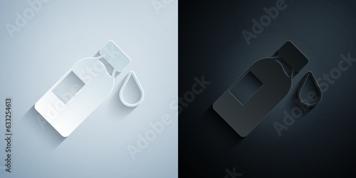 Paper cut Bottle of water icon isolated on grey and black background. Soda aqua drink sign. Paper art style. Vector