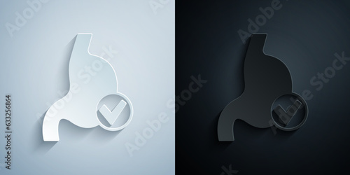 Paper cut Human stomach health icon isolated on grey and black background. Paper art style. Vector