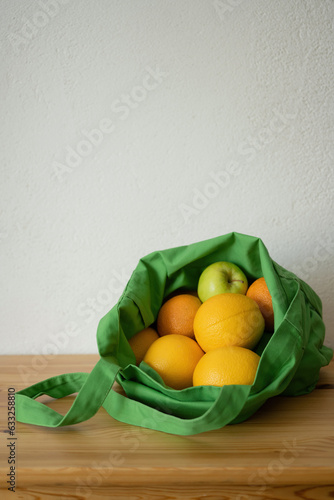 Fototapeta Naklejka Na Ścianę i Meble -  Fresh fruit oranges are in the reusable bag. Eco-friendly product. Concern for the environment. Food delivery.