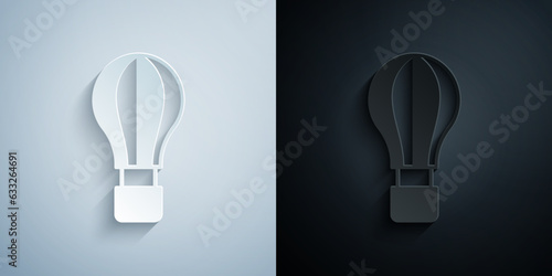 Paper cut Hot air balloon icon isolated on grey and black background. Air transport for travel. Paper art style. Vector