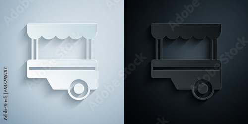 Paper cut Fast street food cart with awning icon isolated on grey and black background. Urban kiosk. Paper art style. Vector