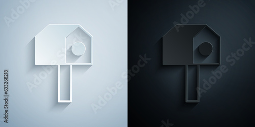 Paper cut Bird house icon isolated on grey and black background. Nesting box birdhouse, homemade building for birds. Paper art style. Vector