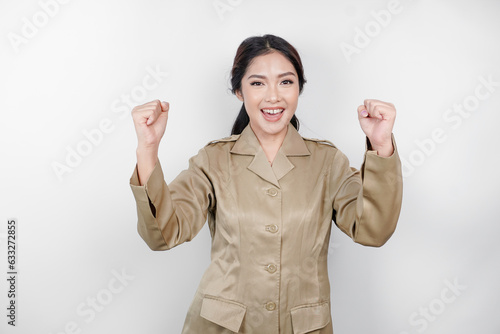 Beautiful Asian woman wearing uniform feeling enthusiast. Success concept of Indonesian government employees photo