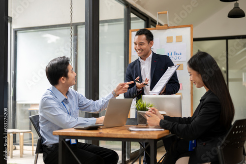 Εκτύπωση καμβά A confident Asian businessman is talking, consulting, and training his team in the meeting