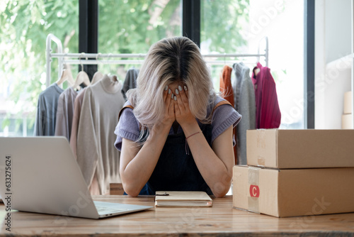 Business owner SME Small business stress depress serious about own online shop,  Young owner business angry sad disappointed with her business