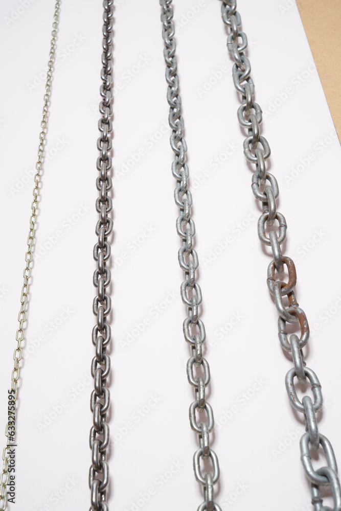 Metal chains on a white background. Metal chains on a white background.