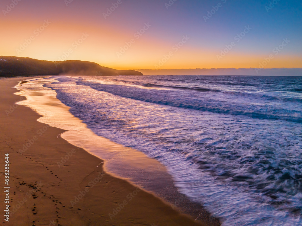 Sunrise and waves at the seaside