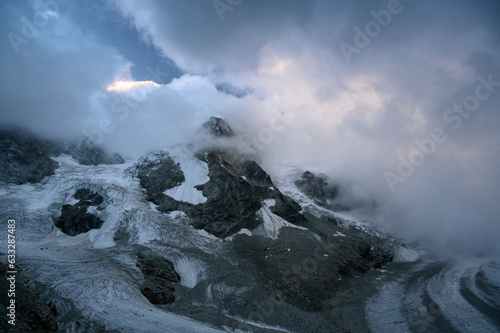 roc noir and Glacier Durand covered in clouds photo