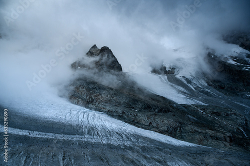 roc noir and Glacier Durand covered in clouds photo