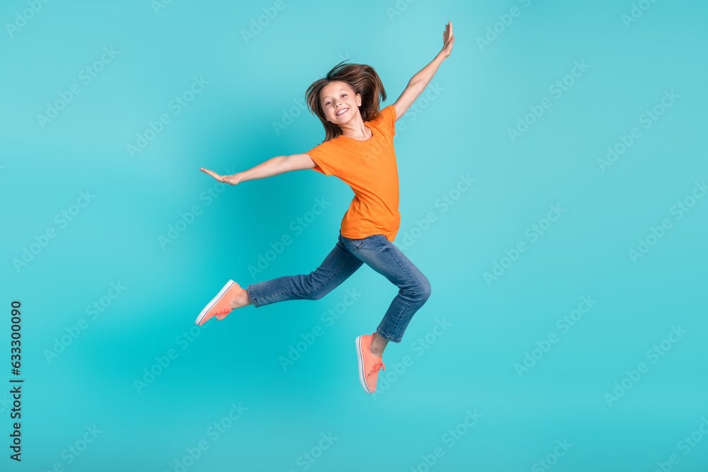 Photo of crazy carefree girl wear stylish clothes fly air have fun rejoice special black friday offer isolated on cyan color background