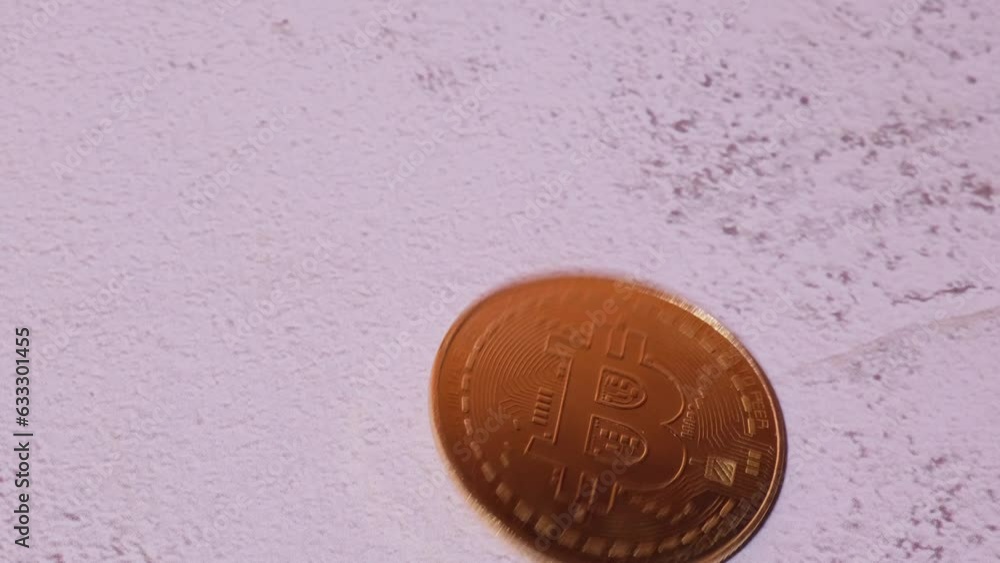 Bitcoin gold coin spins then falls. Bitcoin mining trading concept. BTC golden money spinning around. Worldwide virtual internet Cryptocurrency or crypto digital payment system. Digital coin money Bitcoin gold coin spins then falls. Bitcoin mining trading concept. BTC golden money spinning around. Worldwide virtual internet Cryptocurrency or crypto digital payment system. Digital coin money