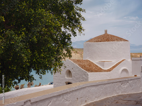 travel to city of Lindos on island of Rhodes, Greece. Details of streets of old town Lindos. Chapel of Saint George Pahimahiotis, 14-th century, in Lindos