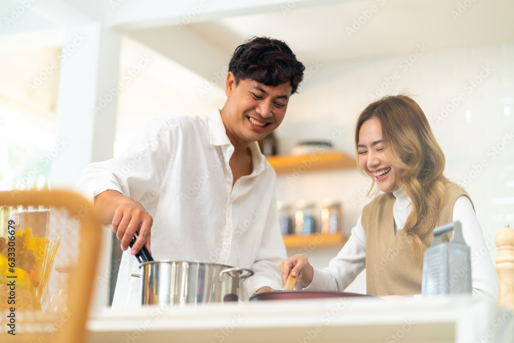 Group of Diversity Asian people cooking healthy food pasta and salad for celebration dinner party together in the kitchen. Cheerful man and woman friend enjoy reunion meeting event on holiday vacation Group of Diversity Asian people cooking healthy food pasta and salad for celebration dinner party together in the kitchen. Cheerful man and woman friend enjoy reunion meeting event on holiday vacation