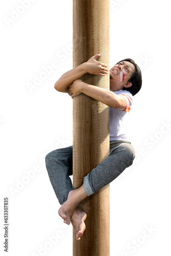 Indonesian men celebrate Indonesian independence day on 17 August with a climb competition photo