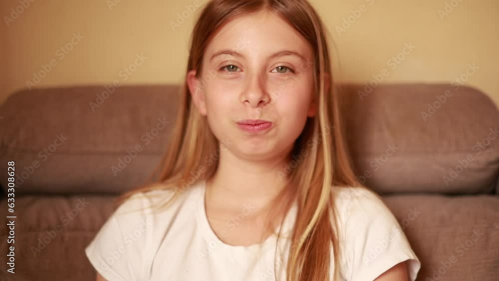 girl eat Muskmelon on the couch and smile girl eat Muskmelon on the couch and smile