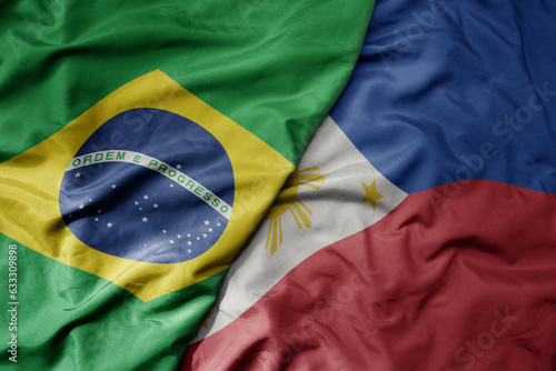 big waving realistic national colorful flag of brazil and national flag of philippines .