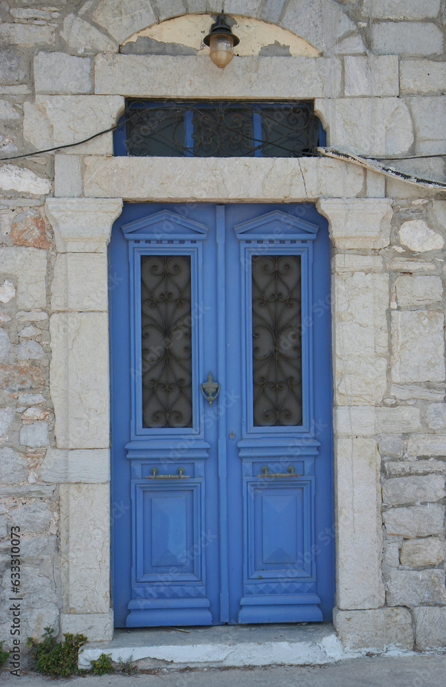 Old Greek Home with Blue Door and Lamp in Symi, Greece