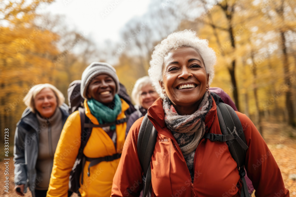 Group of active seniors tourists walking in autumn forest or park together. Group of active seniors tourists walking in autumn forest or park together.