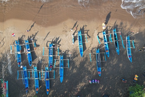 fishing boats anchored on the shore. Indonesia is the largest maritime country in the world that produces a lot of fish catches from the ocean. kapal nelayan pantai Pangandaran. aerial view of shore.  photo