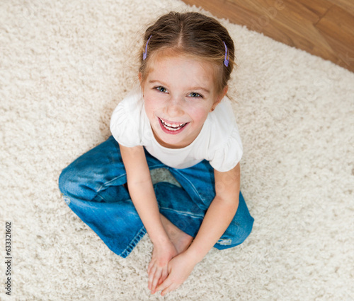 cute little girl sitting on the floor © tan4ikk