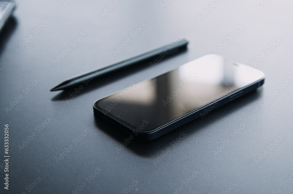 Open laptop with digital tablet and white smartphone. All with isolated screen on old wooden desk. Open laptop with digital tablet and white smartphone. All with isolated screen on old wooden desk.