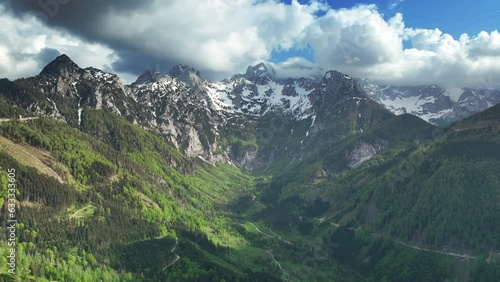 Mountains with a block field and snow around the Zgornje Jezersko valley in Slovenia aerial view during a beautiful springtime day with the mountain range around the Grintovec mountain peak. photo