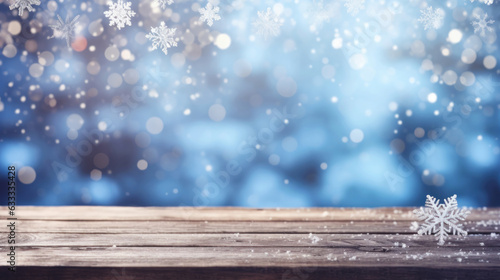 Winter holiday christmas xmas background banner greeting card - Empty old wooden table with blue sky, snowflakes, ice crystals, and bokeh lights in background