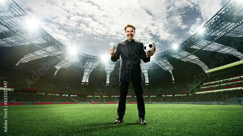 Man in suit celebrating successful betting activity, standing with football ball and money on 3d render arena. Concept of sport, fan, betting and finances, gambling, bookmaker photo