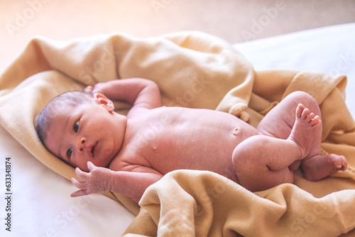 newborn lying unclothed photo