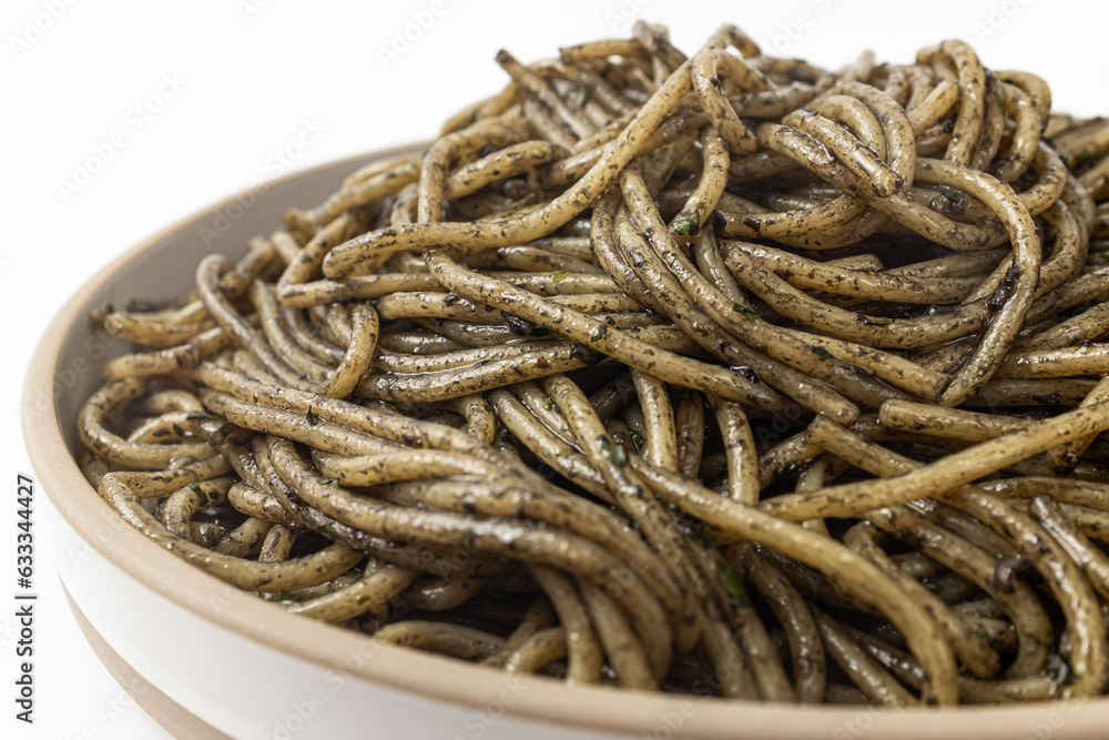 Pasta with squid ink sauce on a white background Pasta with squid ink sauce on a white background