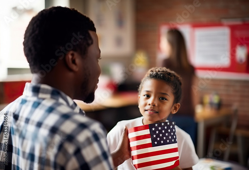 A teacher and a child with a gift with the American flag photo