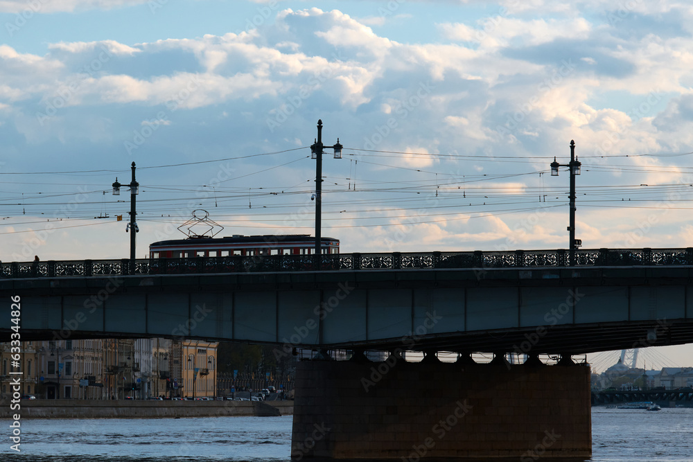 Road bridge across the river of a European city in the evening. Road bridge across the river of a European city in the evening.