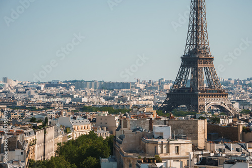 Daytime photo of the Eiffel Tower in Paris  France under a clear blue sky.