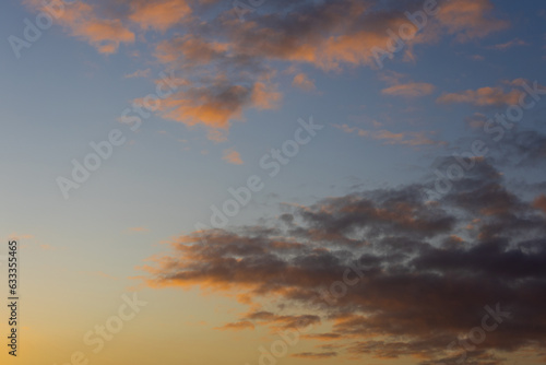 Beautiful warm sunrise sky with clouds.