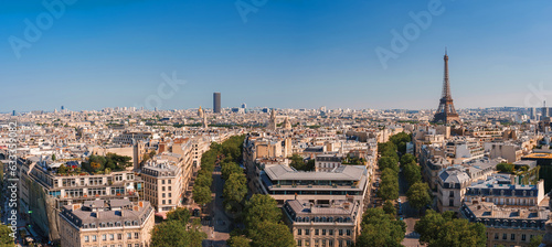 Canvas Print Aerial view of Paris cityscape from the Eiffel Tower under a sunny blue sky