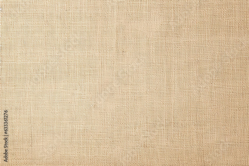 Presenting a light beige cream brown jute hessian sackcloth canvas woven texture pattern background, offering a blank, empty canvas for various creative pursuits