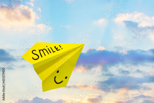 Paper plane Positive emoticons happy smileys concept. Mockup design with airplane background.