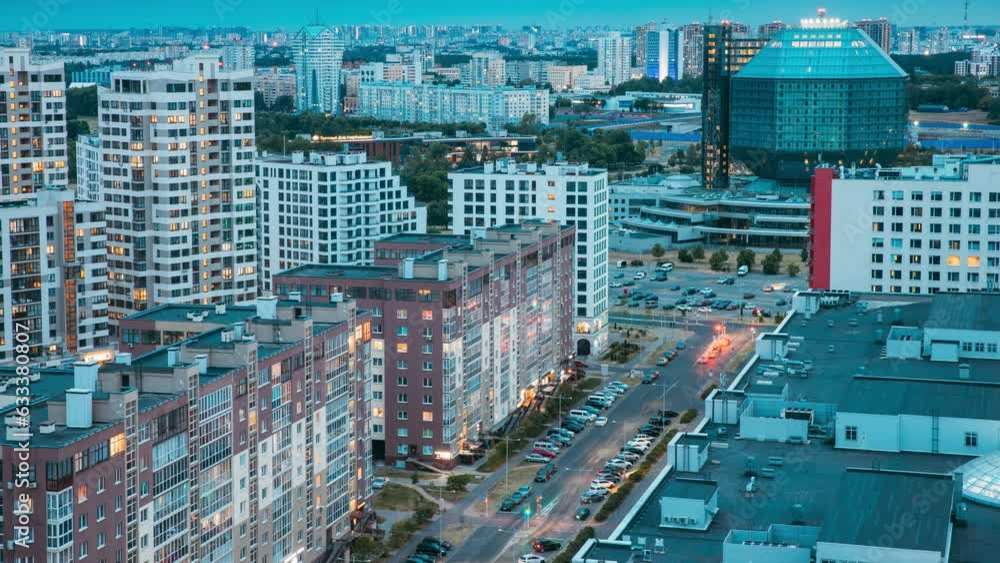 Minsk, Belarus. National Library Building In Evening Night. Famous City Hi-tech Modern Landmark. Time-lapse Evening Lighting Scenic View Of Library. Minsk, Belarus. National Library Building In Evening Night. Famous City Hi-tech Modern Landmark. Time-lapse Evening Lighting Scenic View Of Library.