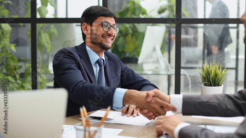 businessman shaking hands in recruiting, teamwork or introduction and welcome at the workplace