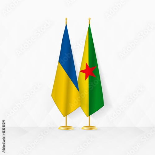 Ukraine and French Guiana flags on flag stand, illustration for diplomacy and other meeting between Ukraine and French Guiana.