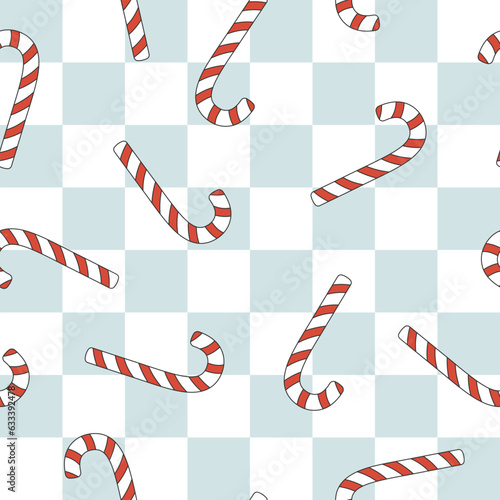 Christmas groovy seamless pattern with candy cane on blue checkerboard background. Retro background for wrapping paper, invitation, greeting card, textile.